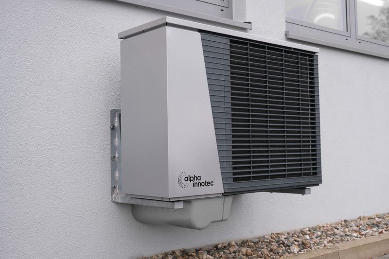 Exterior heat pump unit mounted on a residential building